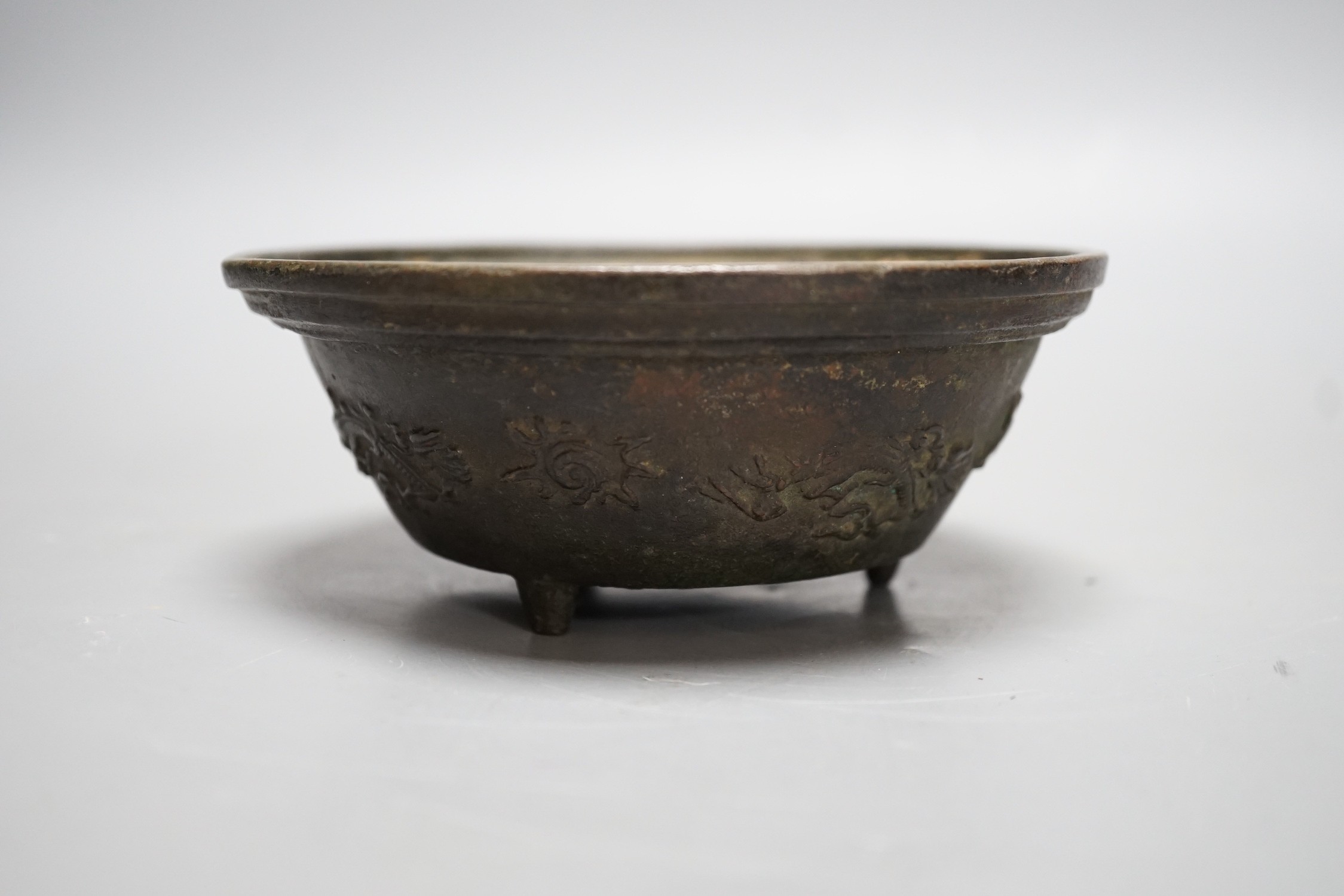 A Chinese bronze bowl, with inscriptions, possibly 18th century, 13.5cm diameter